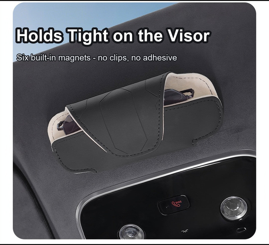 Close-up of the black glasses case held on the car sun visor by built-in magnets