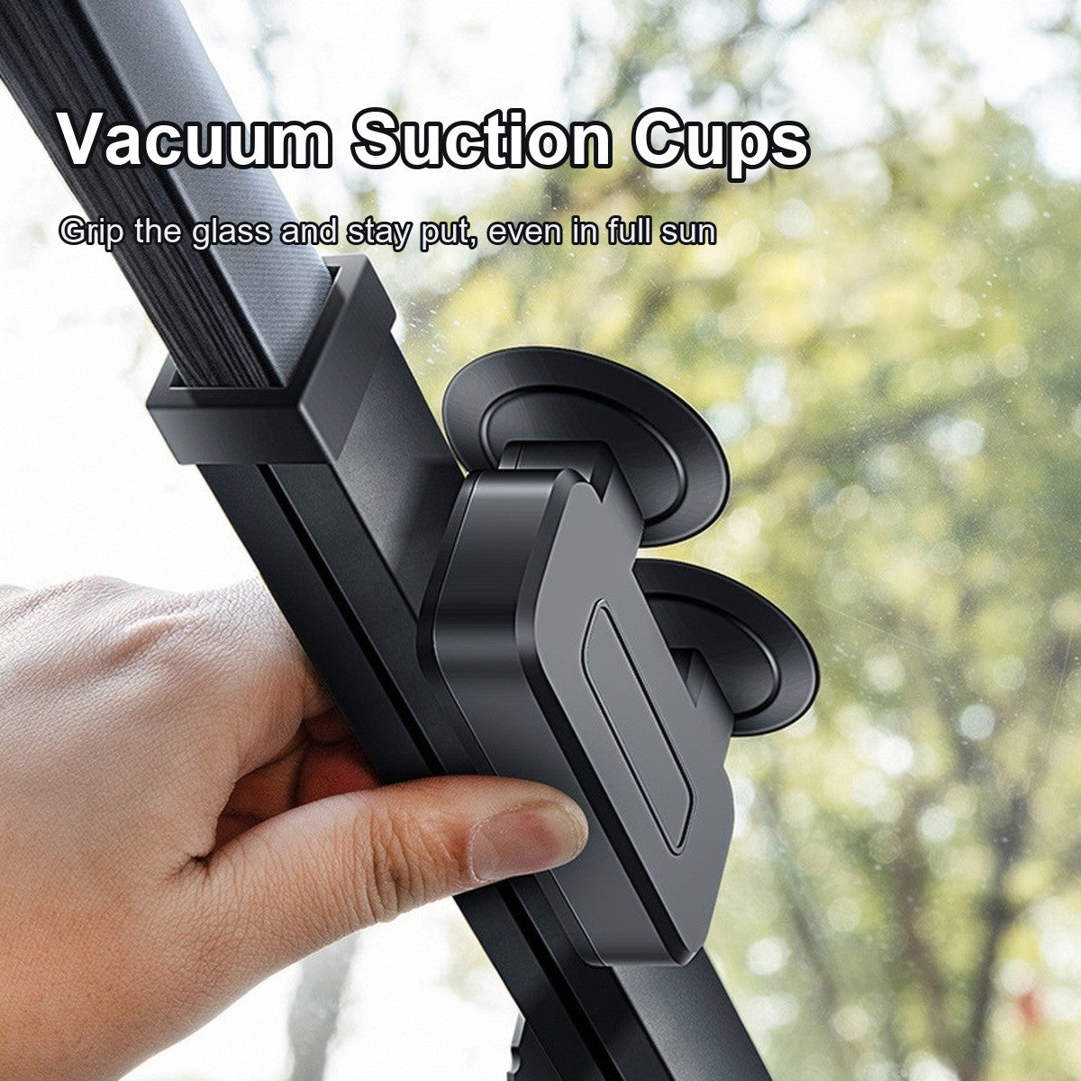 Close-up of the vacuum suction cup holding the shade against the glass