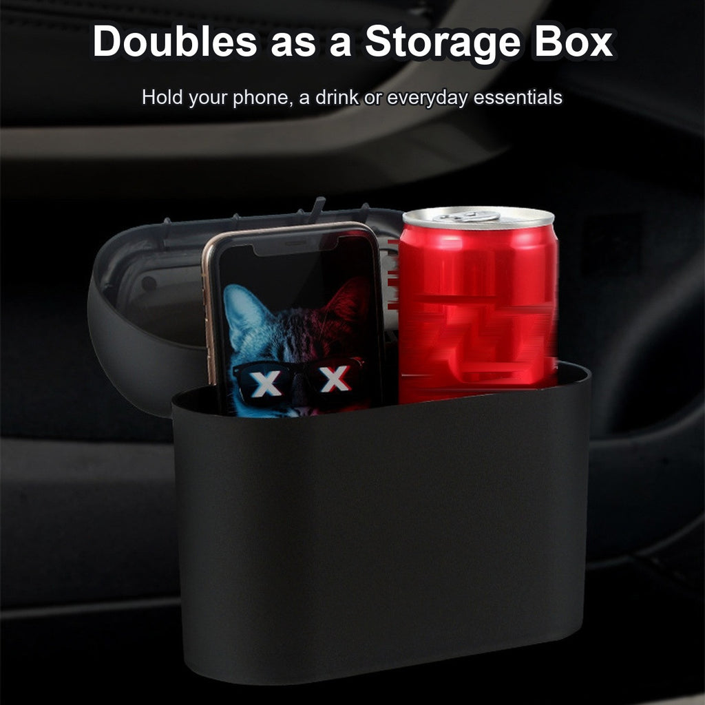 Car trash can doubling as a storage box holding a phone and a drink can